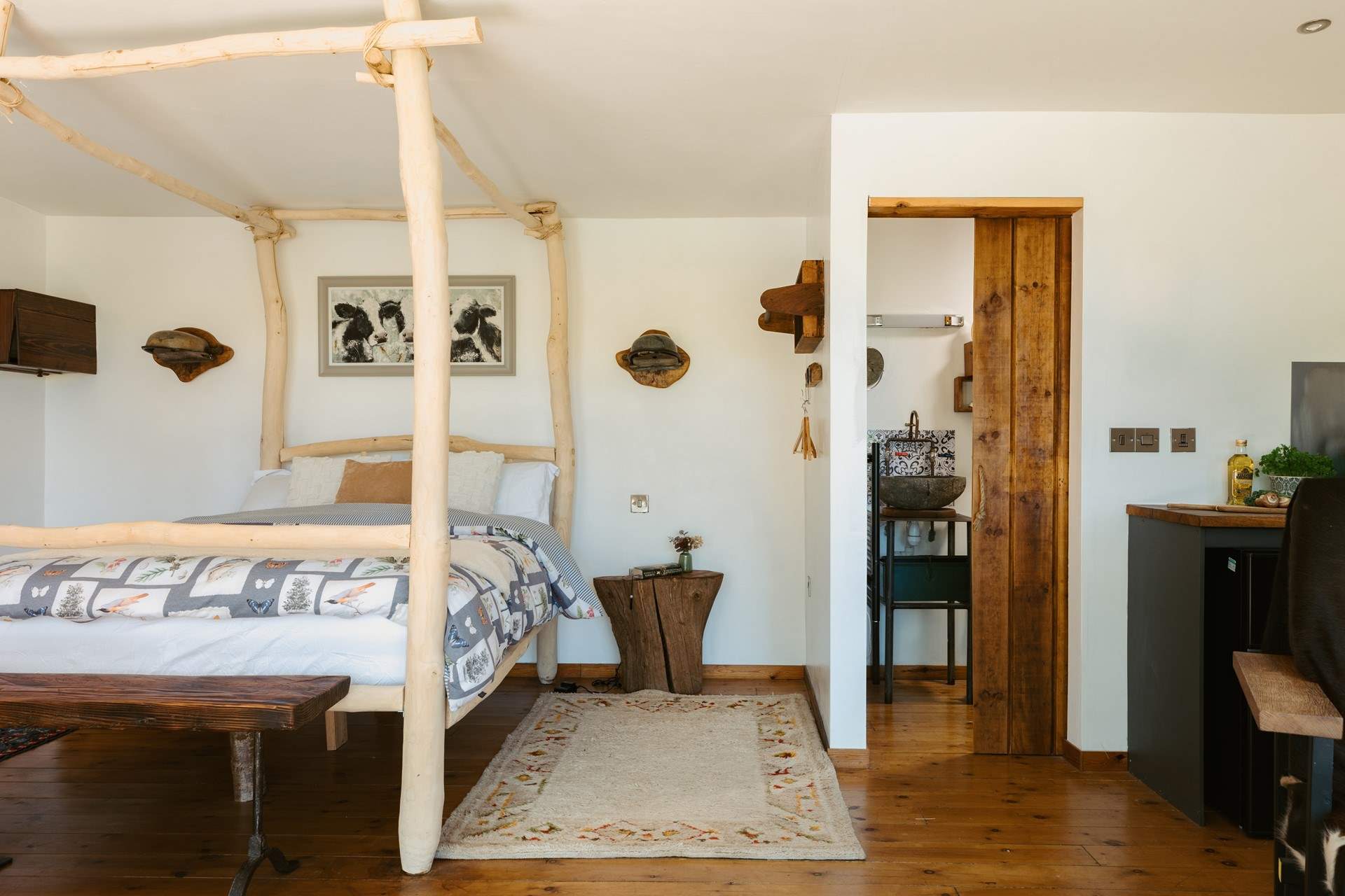The four-poster bed is one of many stunning features in the hideaway. 