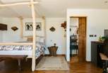 The four-poster bed is one of many stunning features in the hideaway. 