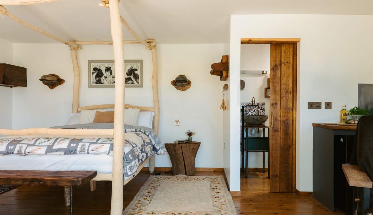 The four-poster bed is one of many stunning features in the hideaway. 
