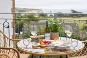 Treat yourself to a spot of al fresco dining on the fabulous balcony with sea views.