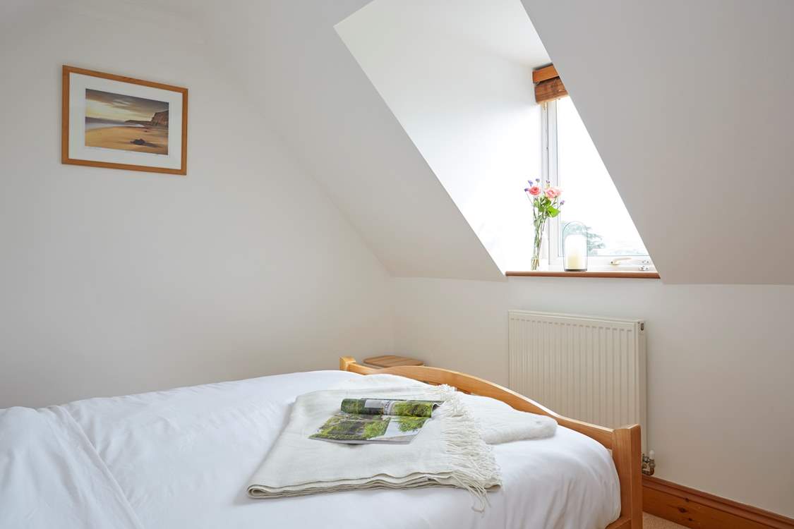 Wake to the crisp morning sun creeping in through the wooden blinds in bedroom one.