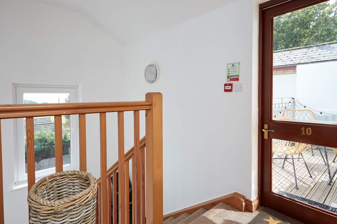 The balcony can also be accessed from the small landing outside the flat.