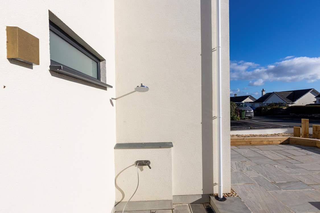 Rinse sandy toes, wetsuits and salty dogs in the handy outside shower at the front of the property.
