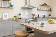 Guests can perch at the breakfast bar and supervise the chef.