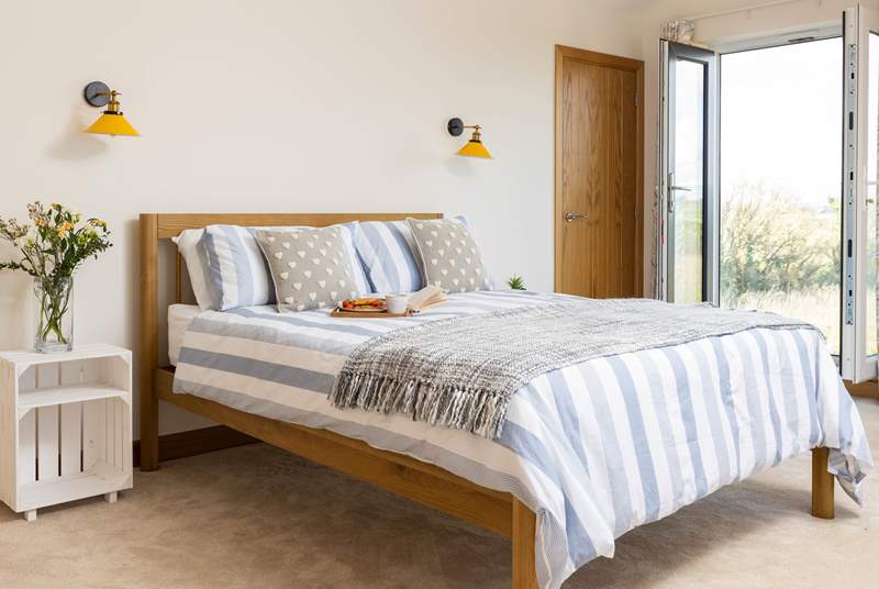 Climb the stairs to the first floor and delightful bedroom 2 awaits with fabulous views towards Gull Rock and Gerrans Bay.