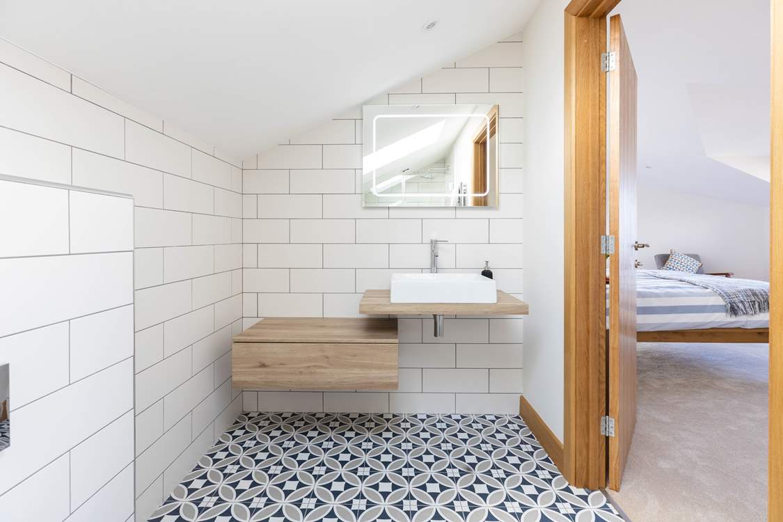 Not only does bedroom 2 have a stunning en suite shower-room, but you will also find a separate dressing room.