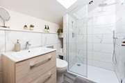 The sleek en suite shower-room to bedroom 3.