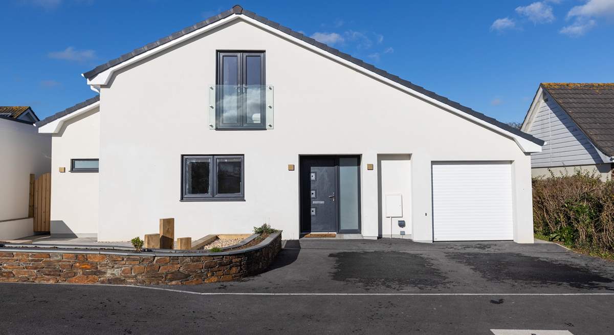 Holiday living at its best. There's parking for 2 cars on the drive but the garage is not for guest use.