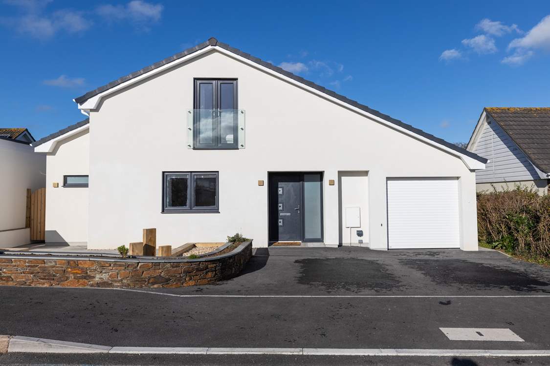 Holiday living at its best. There's parking for 2 cars on the drive but the garage is not for guest use.