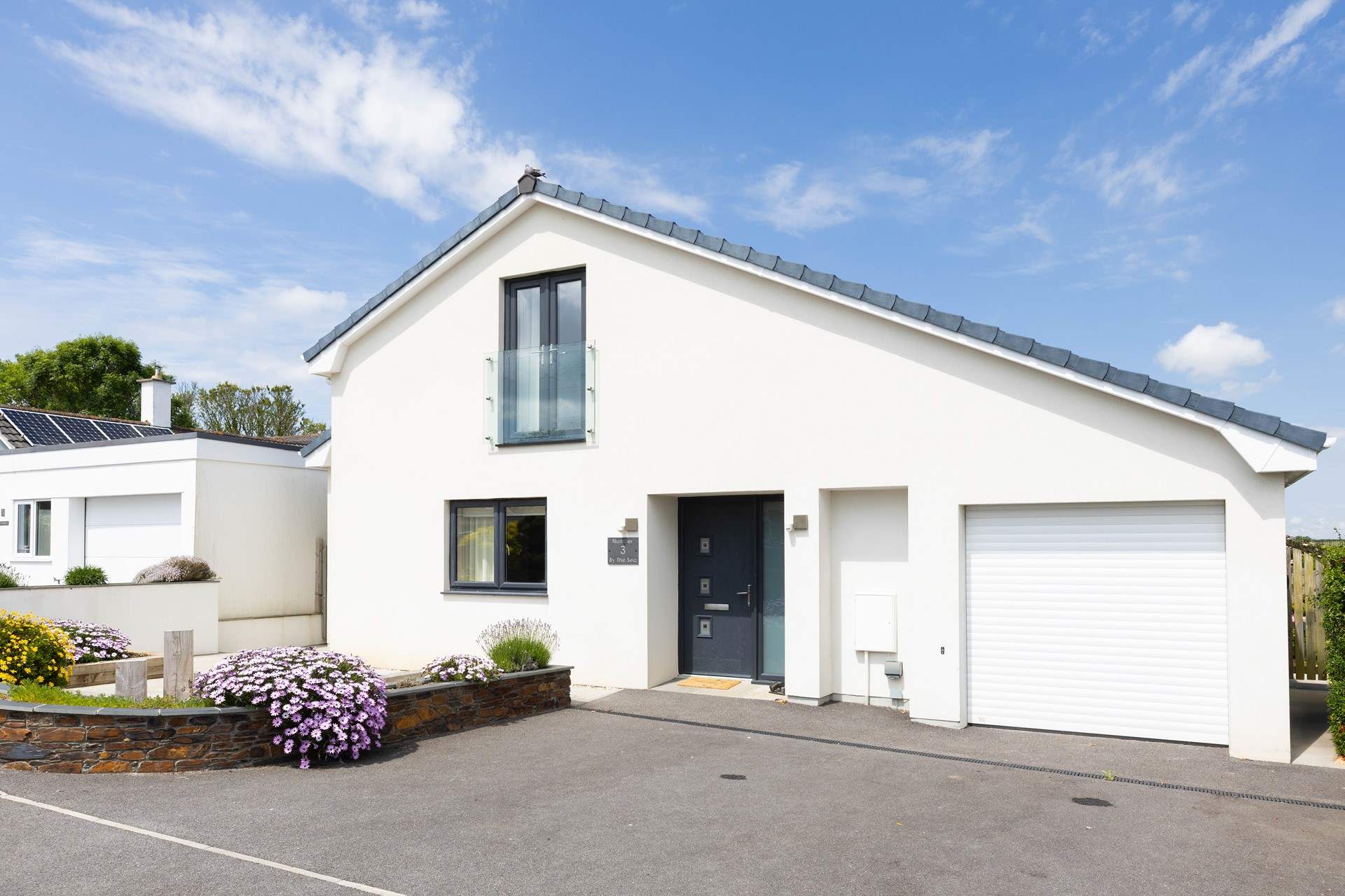 Holiday living at its best. There's parking for 2 cars on the drive but the garage is not for guest use.