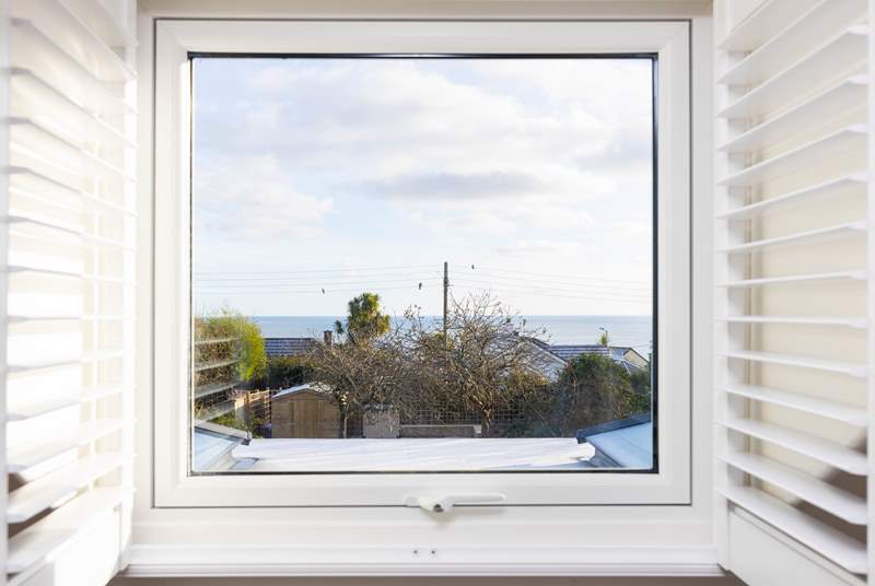 Looking out over the rooftops towards Gull Rock and Gerrans Bay.