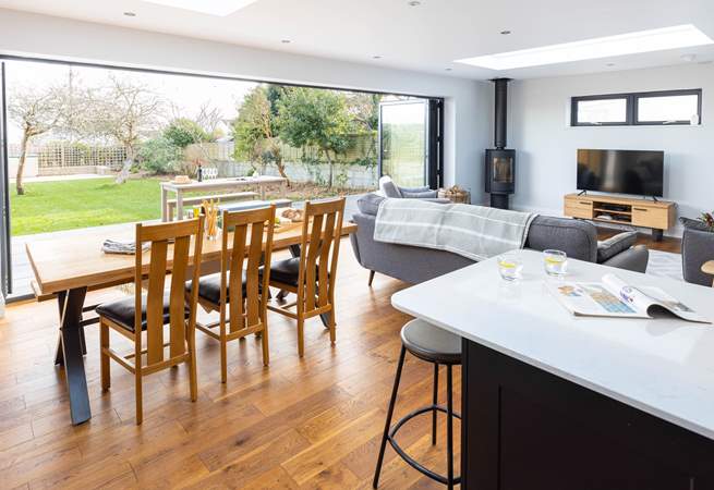 Wall length bi-fold doors lead into the spacious garden.