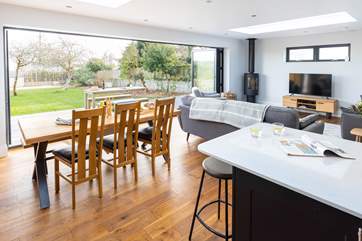 Wall length bi-fold doors lead into the spacious garden.