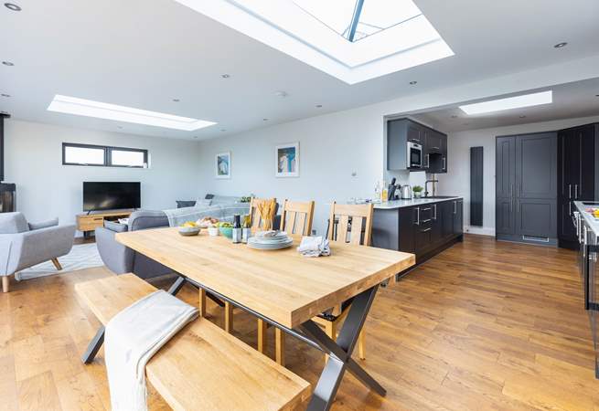 The L-shaped open plan living space is light and bright thanks to the feature atrium windows in the ceiling.