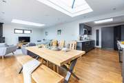 The L-shaped open plan living space is light and bright thanks to the feature atrium windows in the ceiling.