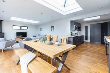 The L-shaped open plan living space is light and bright thanks to the feature atrium windows in the ceiling.