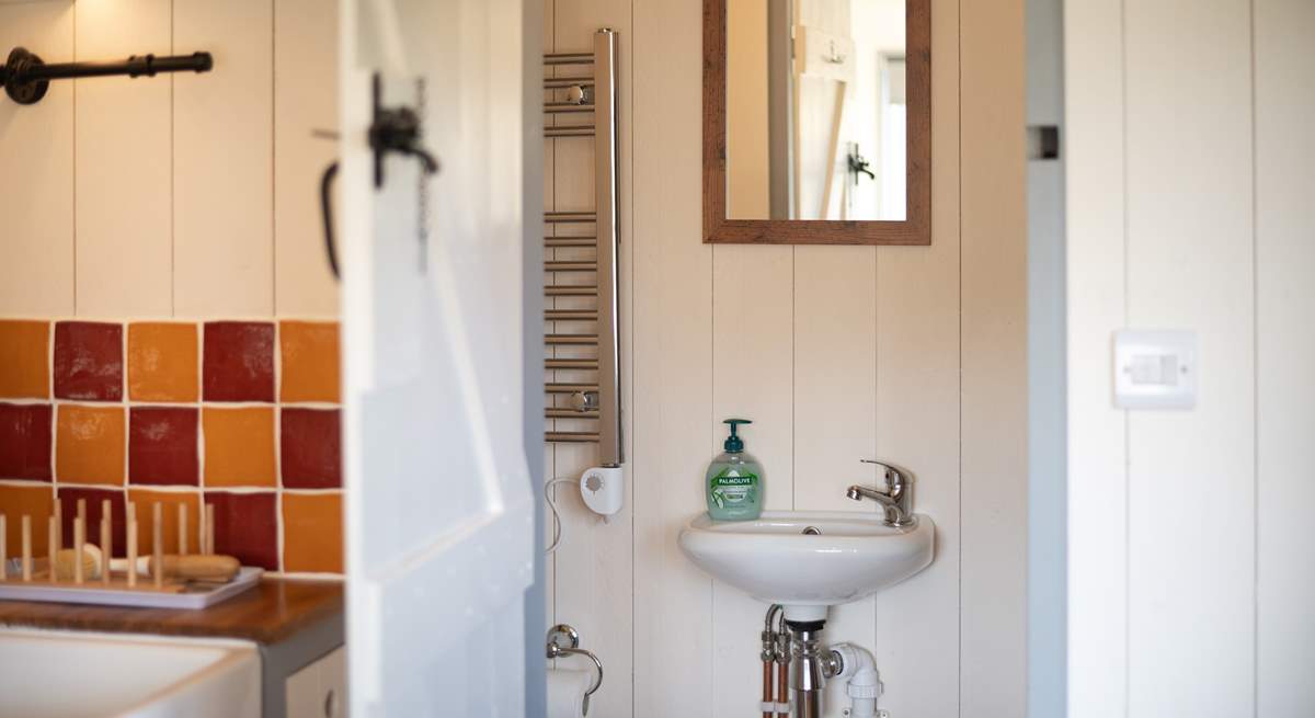 The en suite shower-room sits to the right of the hut. 