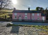 The owner's gorgeous pink cottage is a great landmark to look for when finding Ffion. 