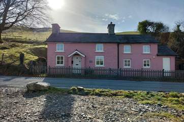 The owner's gorgeous pink cottage is a great landmark to look for when finding Ffion.