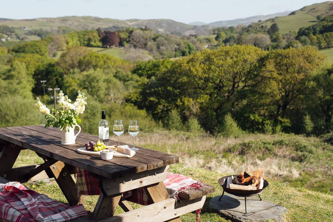 Why not dine al fresco by the warmth of the fire-pit?