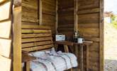 The handcrafted shelter allows you space to sit out and enjoy the views, whatever the weather.  - Thumbnail Image