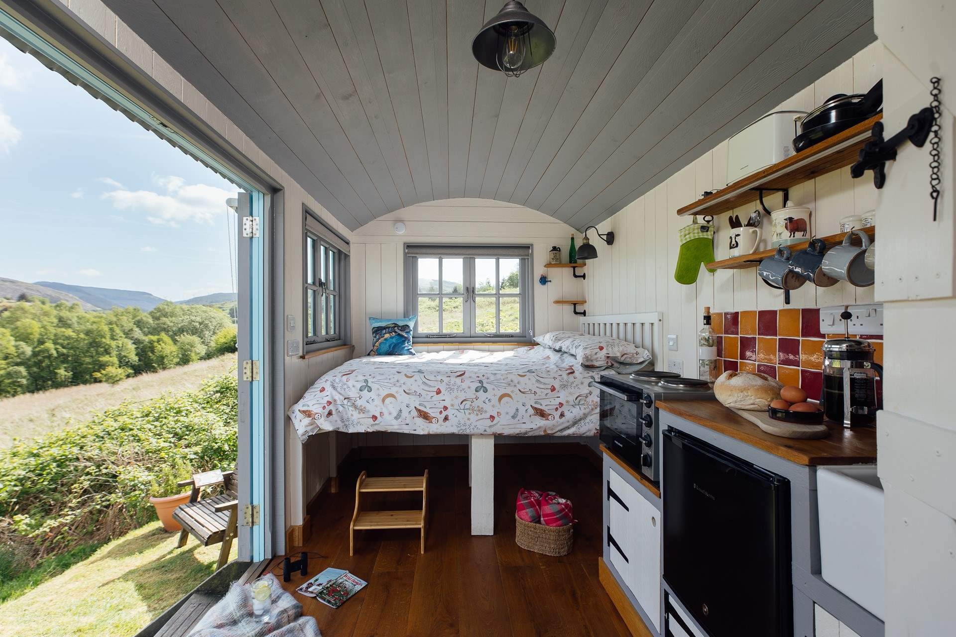 The double bed is perfectly positioned to make the most of your surroundings. 