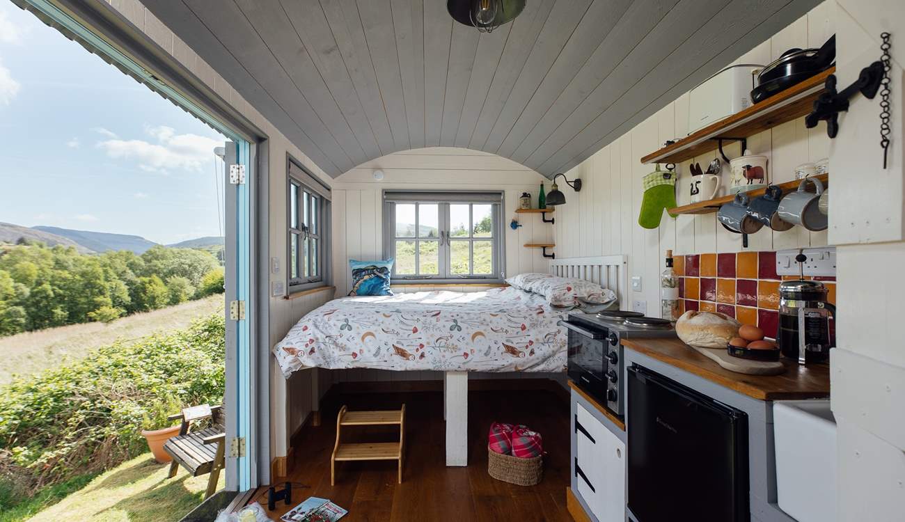 The double bed is perfectly positioned to make the most of your surroundings. 