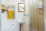 The en suite shower room sits to the right of the hut. 