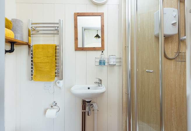 The en suite shower room sits to the right of the hut. 