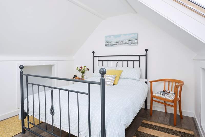 Another inviting king-size bed can be found upstairs.