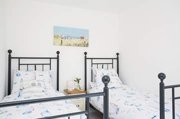 Bedroom one has two single beds ideal for younger guests
