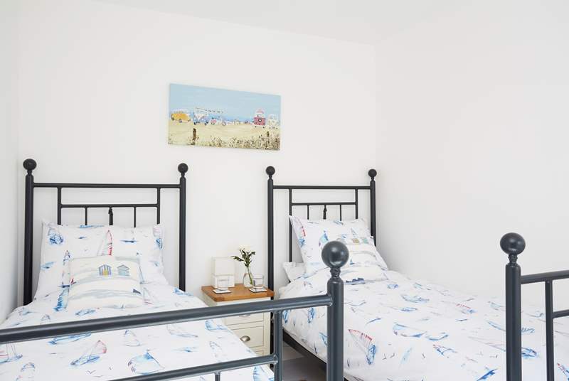 Bedroom one has two single beds ideal for younger guests