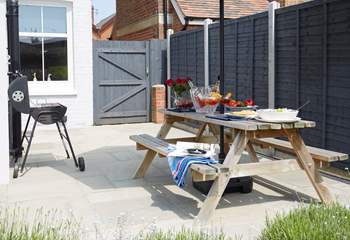 The patio area in the back garden has plenty of space for the BBQ and al fresco dining. 