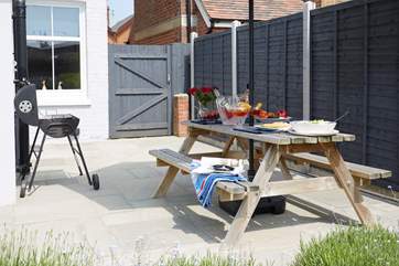 The patio area in the back garden has plenty of space for the BBQ and al fresco dining.