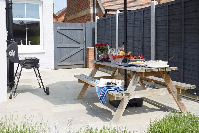 The patio area in the back garden has plenty of space for the BBQ and al fresco dining. 
