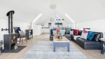 Light and airy interiors provide the ideal spot to relax and unwind in this beautiful space with vaulted ceilings.