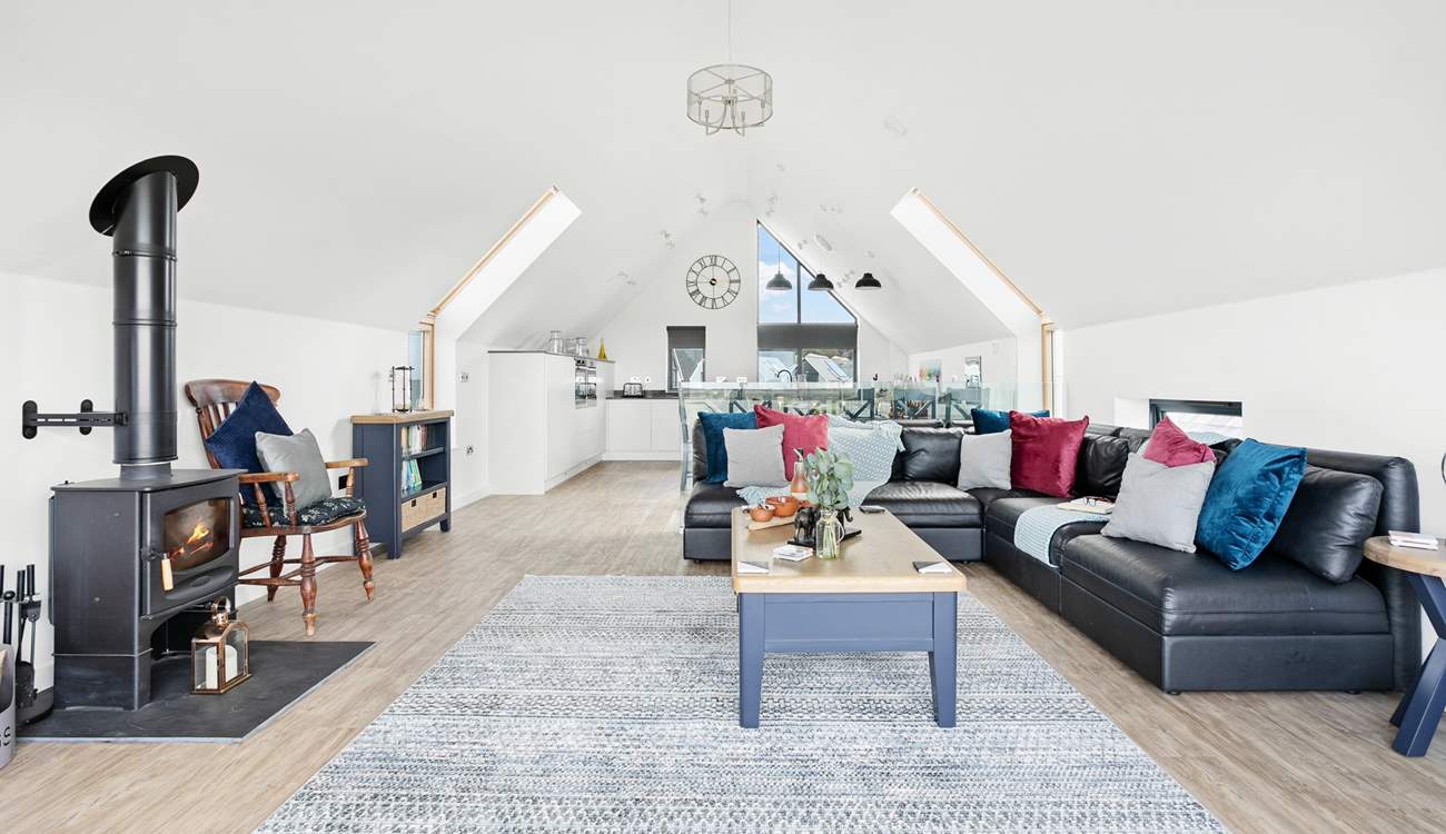 Light and airy interiors provide the ideal spot to relax and unwind in this beautiful space with vaulted ceilings.