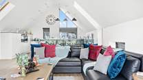 Relax on the indulgent corner sofa and enjoy the light and airy atmosphere created by the high ceilings.