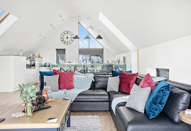 Relax on the indulgent corner sofa and enjoy the light and airy atmosphere created by the high ceilings.