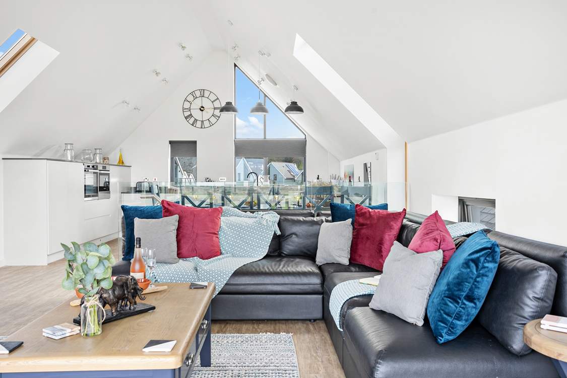 Relax on the indulgent corner sofa and enjoy the light and airy atmosphere created by the high ceilings.