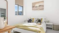 Here you will find bedroom one, which houses an indulgent king-size bed and is flooded with light thanks to the high ceilings.