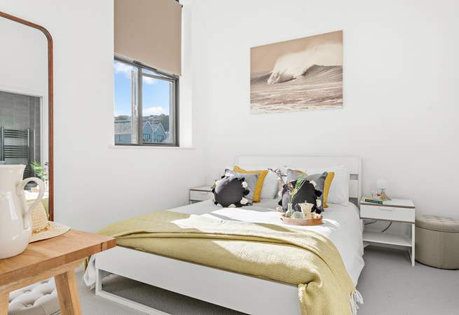 Here you will find bedroom one, which houses an indulgent king-size bed and is flooded with light thanks to the high ceilings.