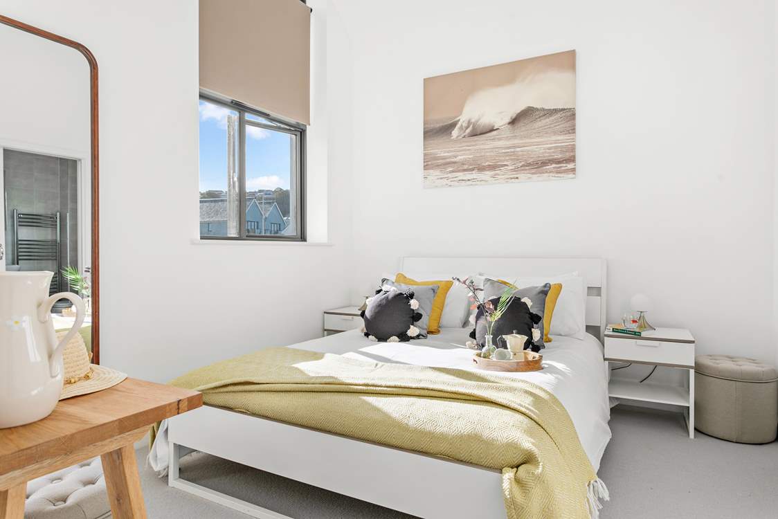 Here you will find bedroom one, which houses an indulgent king-size bed and is flooded with light thanks to the high ceilings.