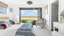 Next door you'll find bedroom two, with its fantastic bi-folding doors and views that will captivate you!