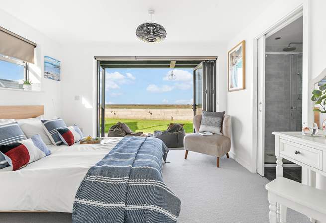 Next door you'll find bedroom two, with its fantastic bi-folding doors and views that will captivate you!
