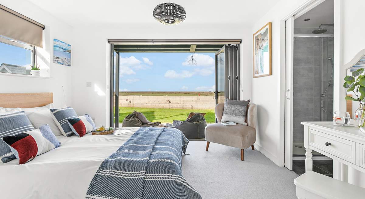 Next door you'll find bedroom two, with its fantastic bi-folding doors and views that will captivate you!