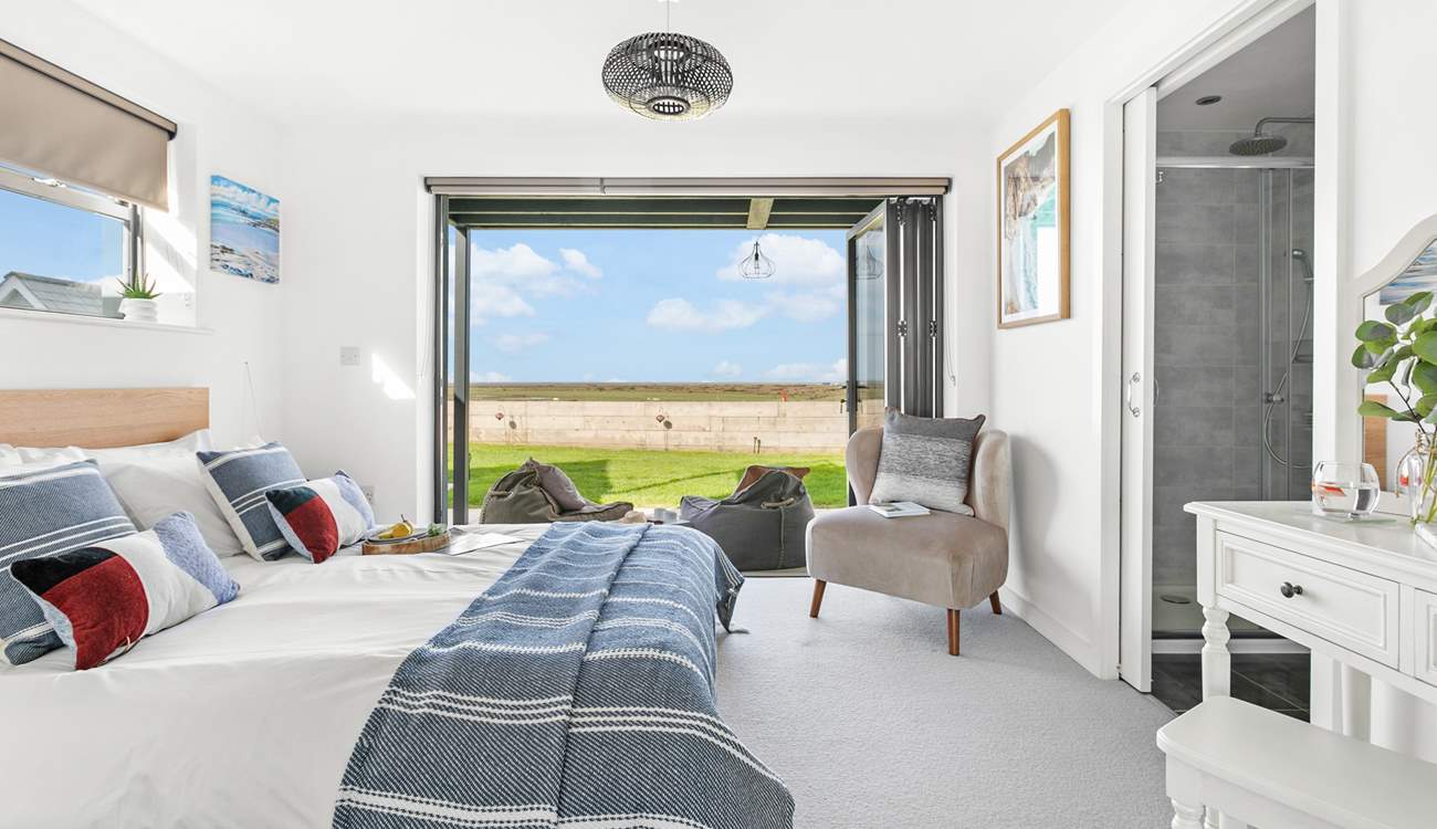 Next door you'll find bedroom two, with its fantastic bi-folding doors and views that will captivate you!