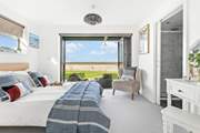 Next door you'll find bedroom two, with its fantastic bi-folding doors and views that will captivate you!