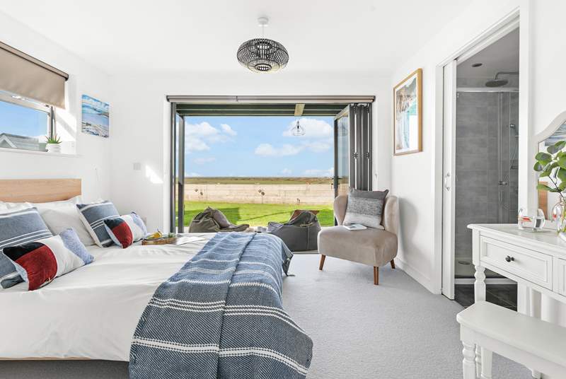 Next door you'll find bedroom two, with its fantastic bi-folding doors and views that will captivate you!