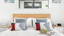 You'll find another inviting king-size bed in this room.